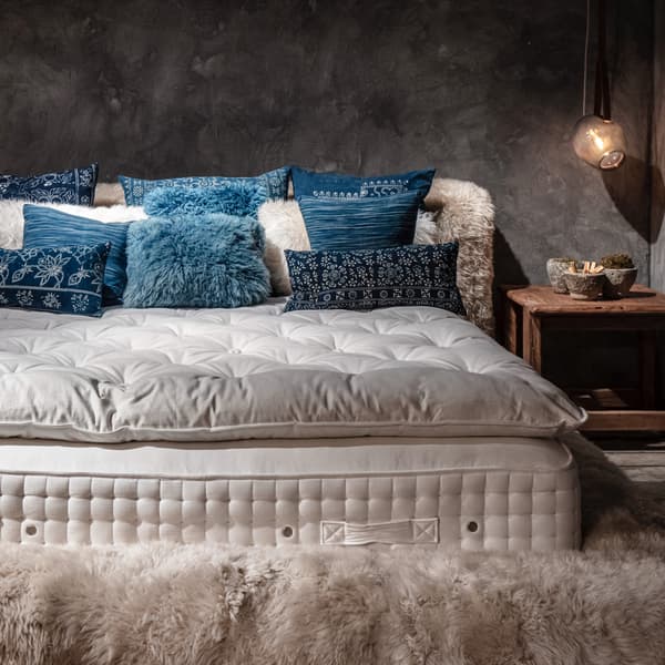Ovis Bed Frame in Yeti Beige featuring multiple cushions 