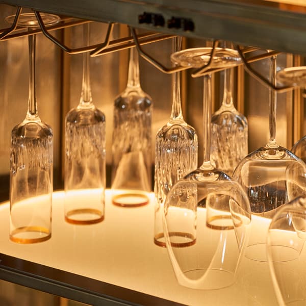 Shimmer bar cabinet close up view of shelf with glasses