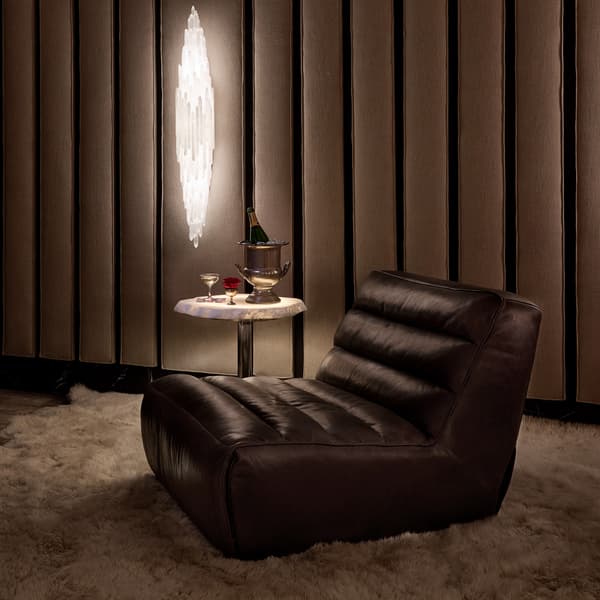 Slouchy recliner chair side view displayed in room setting