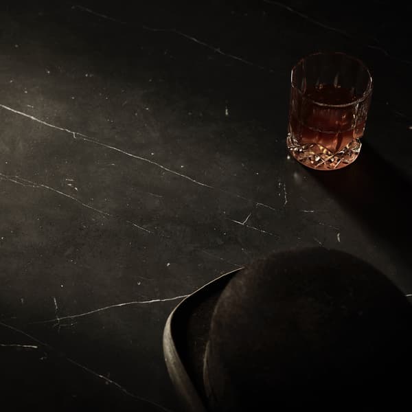 Okinawa table featuring bowler hat and glass