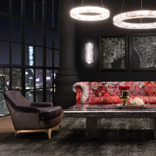 Bastille armchair side view featured in room setting next to sofa
