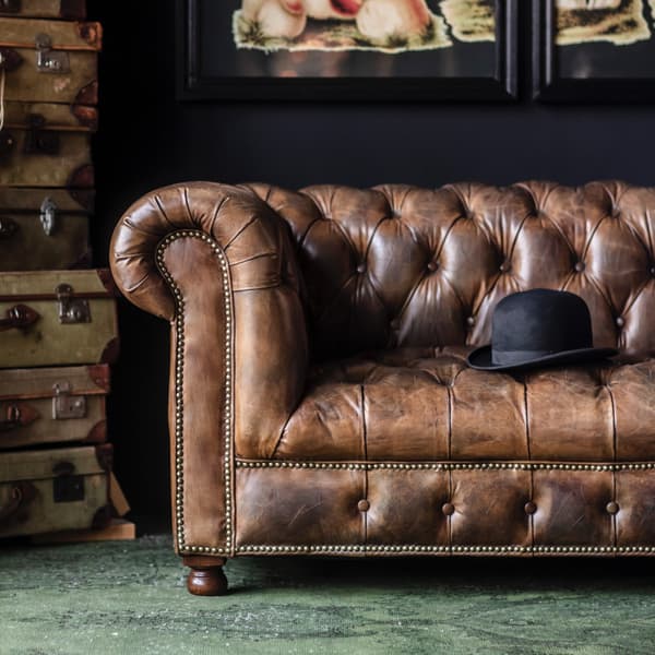 Westminster Buttoned Sofa cropped image featuring black bowler hat