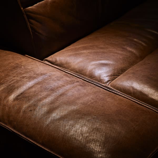 scrambler sectional sofa close up image of leather detail and stitching